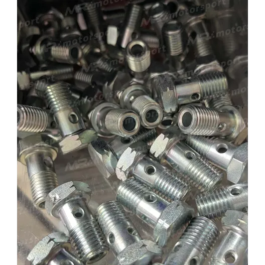 Perforated screw for turbocharger oil inlet without filter